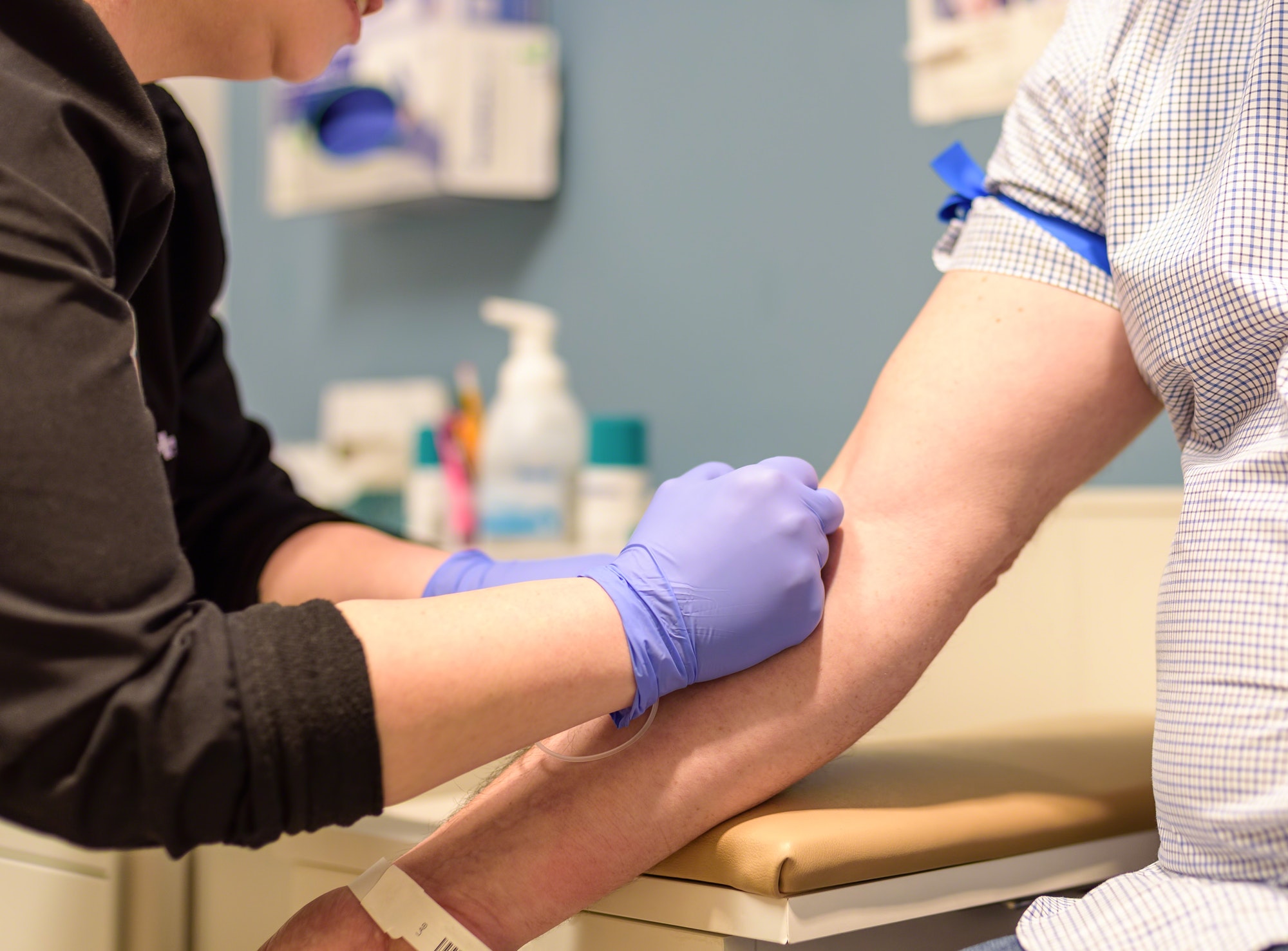 Man getting a blood draw at physician’s office